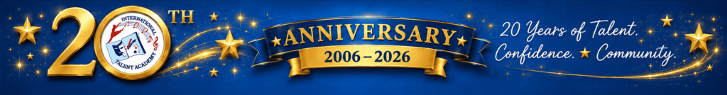 Blue banner celebrating the 20th anniversary 20062026 of international talent academy with a gold ribbon logo seal and star decorations from a festive event display